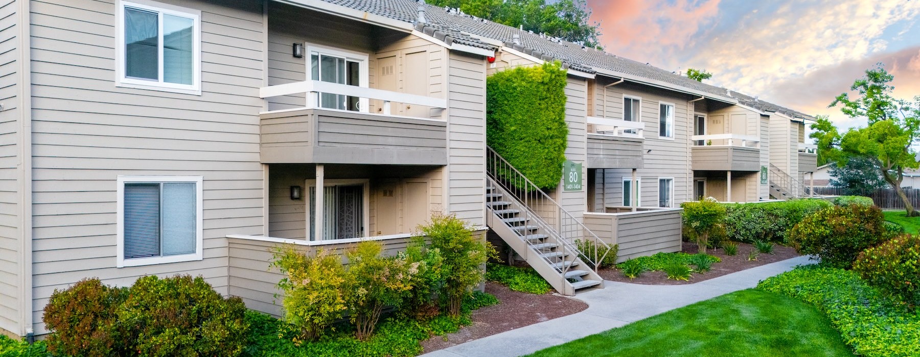 outdoor grassy area with a sidewalk